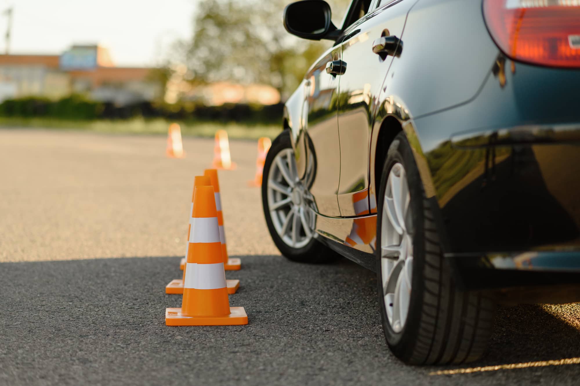 car-and-traffic-cones-driving-school-concept-2023-11-27-04-49-18-utc